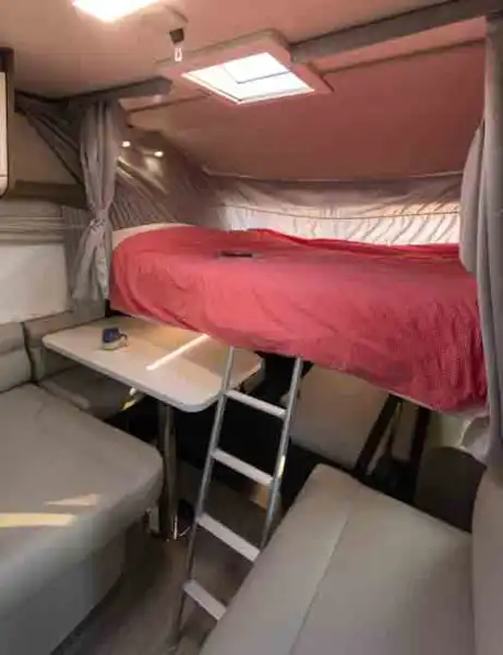 The drop-down bed above the cab © Warners Group Publications, 2019 (Click to view full screen)