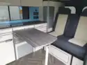 Dining table and seats in the Calder Campers Renault Trafic Auto campervan
