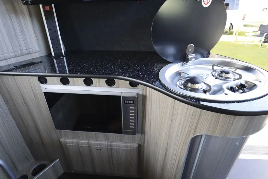 A close up of the kitchen in the Imperial VW T6 L-shape campervan (Click to view full screen)