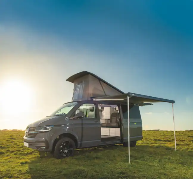 With the pop-top roof up and awning extended (Click to view full screen)