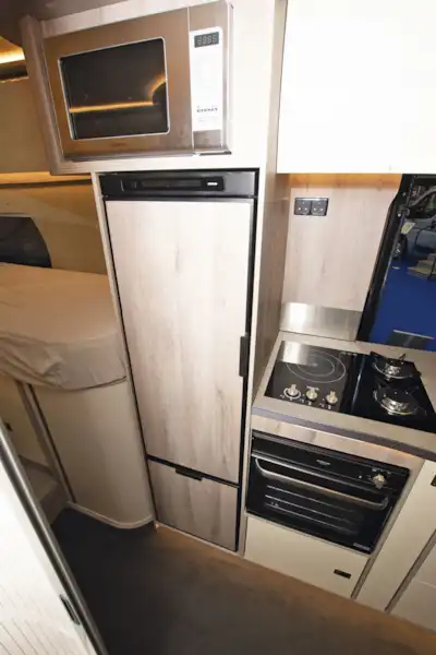 The kitchen, with fridge beside it, in the WildAx Elara campervan (Click to view full screen)