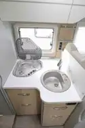 The kitchen, complete with circular sink and three burner gas hob © Warners Group Publications, 2019