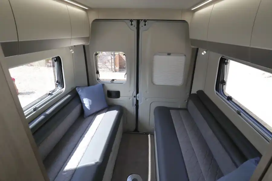 The rear lounge, with side-facing sofas, in the Auto-Trail Adventure 65 campervan (Click to view full screen)