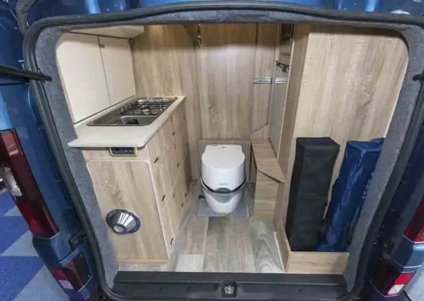 The rear of the campervan, with kitchen and toilet © Warners Group Publications, 2019 (Click to view full screen)