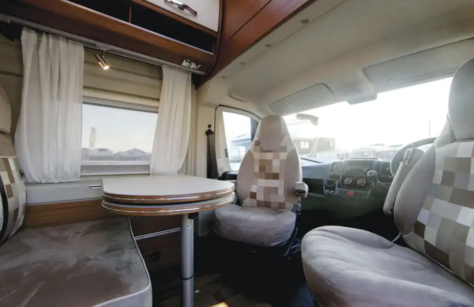 The lounge and dining area in the Globecar Campscout Revolution campervan (Click to view full screen)