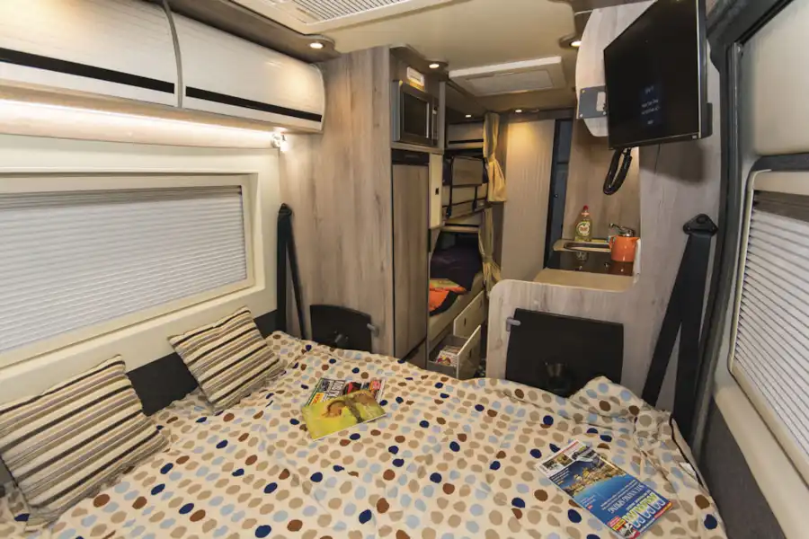 The double bed in the WildAx Solaris XL campervan (Click to view full screen)