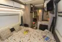 The double bed in the WildAx Solaris XL campervan