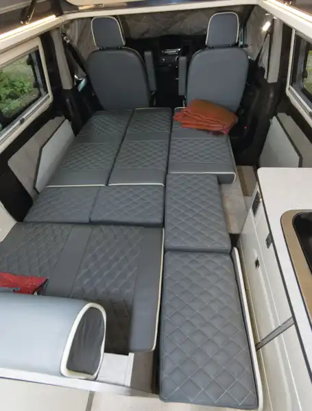 With seats folded down into beds (Click to view full screen)