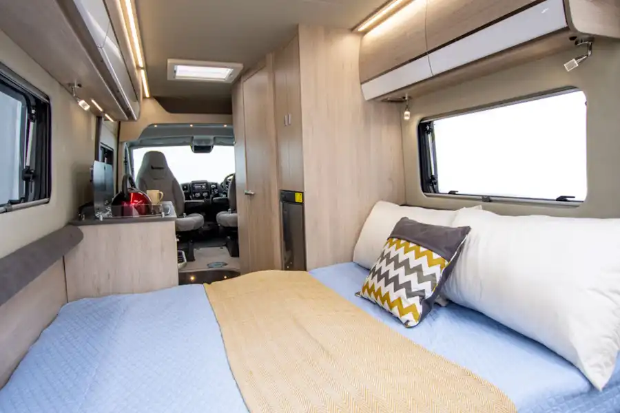 View of the bed and the interior in the Benivan 120 campervan (Click to view full screen)