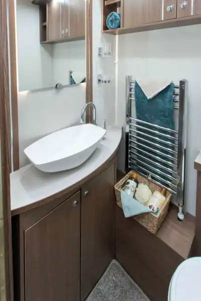 A large Alde heated towel rail next to the wash basin (Click to view full screen)