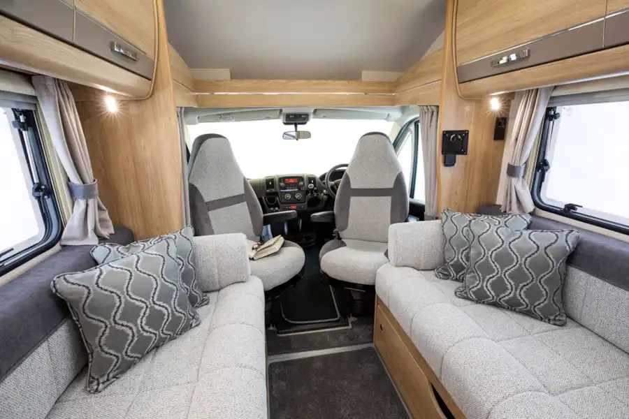 A view of the cab and the side-facing sofas in the Elddis Autoquest 194 motorhome (Click to view full screen)