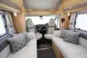 A view of the cab and the side-facing sofas in the Elddis Autoquest 194 motorhome