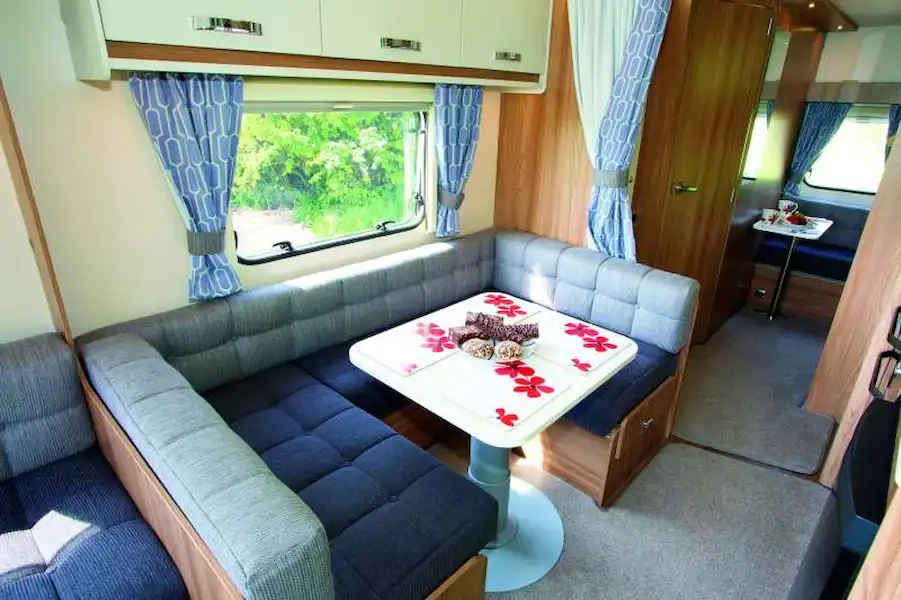 A big dining area in the centre of the caravan - and a small one at the rear! (Click to view full screen)