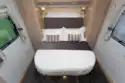 The bed expands and retracts to create more bed length or more corridor space