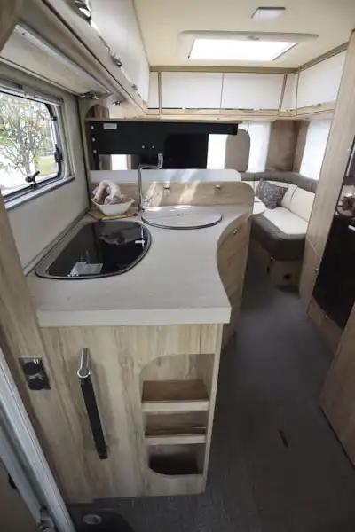 The neat side kitchen in the Eura Mobil Integra Line 650 HS motorhome (Click to view full screen)