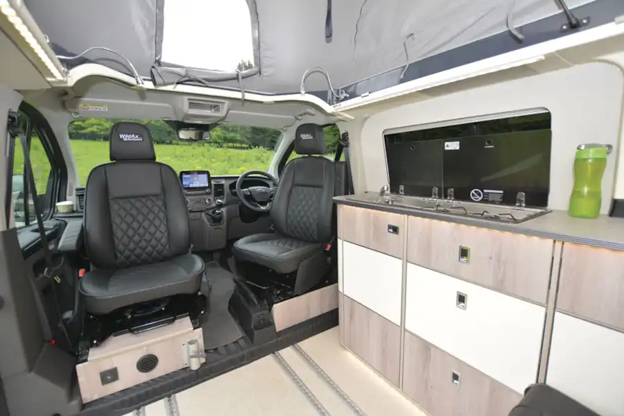 A view of the cab seats in the WildAx Proteus campervan (Click to view full screen)
