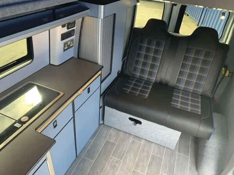 Seating and the kitchen area in the Camper conversions Brawbus (Click to view full screen)