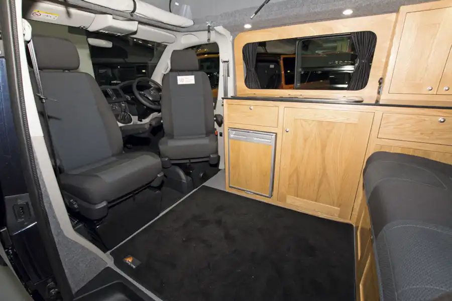 With cab seats turned to face the lounge area in the Rolling Homes Columbus S campervan (Click to view full screen)