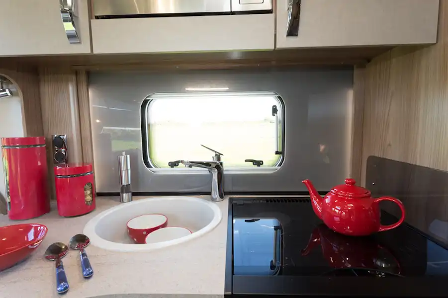 The kitchen wall has lighting fitted behind it (Click to view full screen)