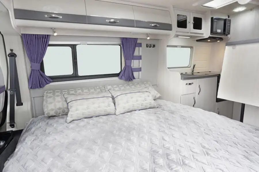 The double bed in the Auto-Sleeper Kemerton XL campervan (Click to view full screen)