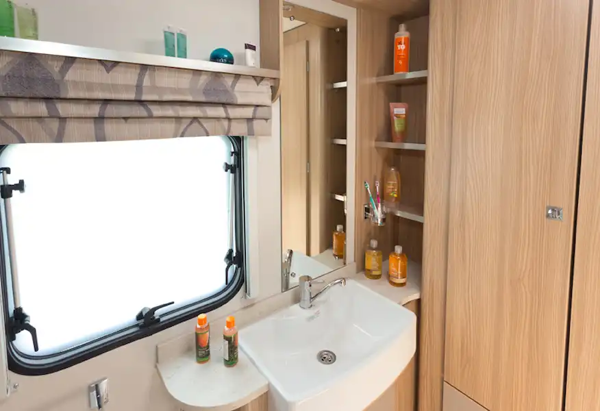 Plenty of shelving in the rear shower room (Click to view full screen)