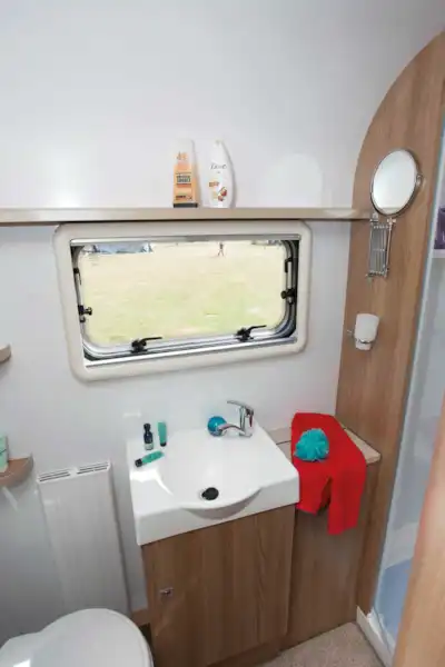 Next to the sink is a deep cabinet, ideal for storing towels (Click to view full screen)
