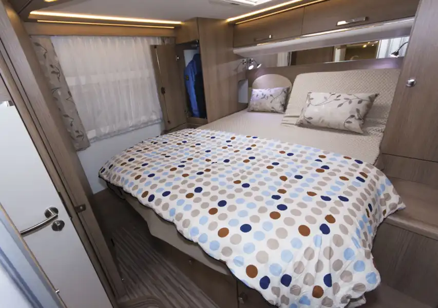 The large double bed in the Malibu I 500 QB Touring motorhome (Click to view full screen)