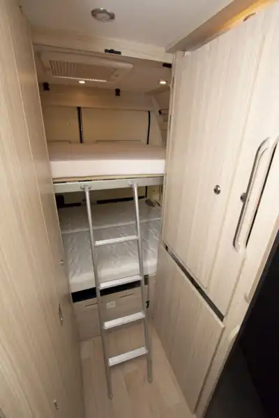 Ladder access to the top bunk bed in the Dreamer D53 Fun campervan (Click to view full screen)