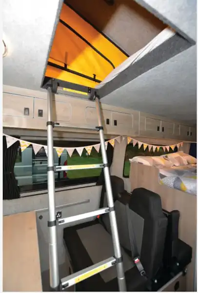 The Standout Campers VW Crafter campervan bed access (Click to view full screen)